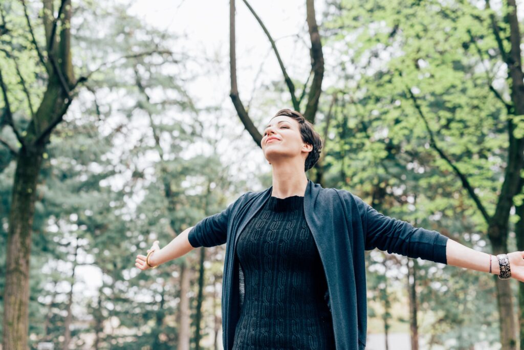 Young woman outdoor feeling free